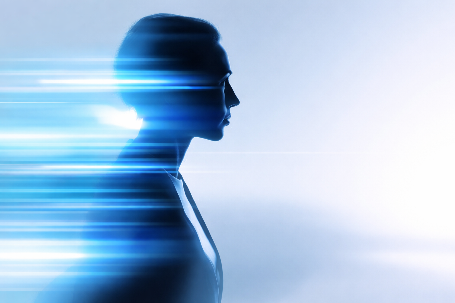 Profile silhouette with streaks of blue light representing clarity emerging from complexity